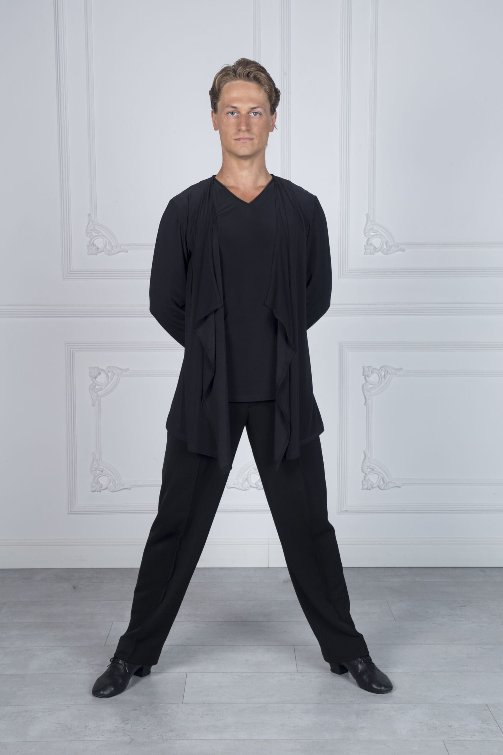 Model in elegant black dancewear, showcasing a refined look for performances.