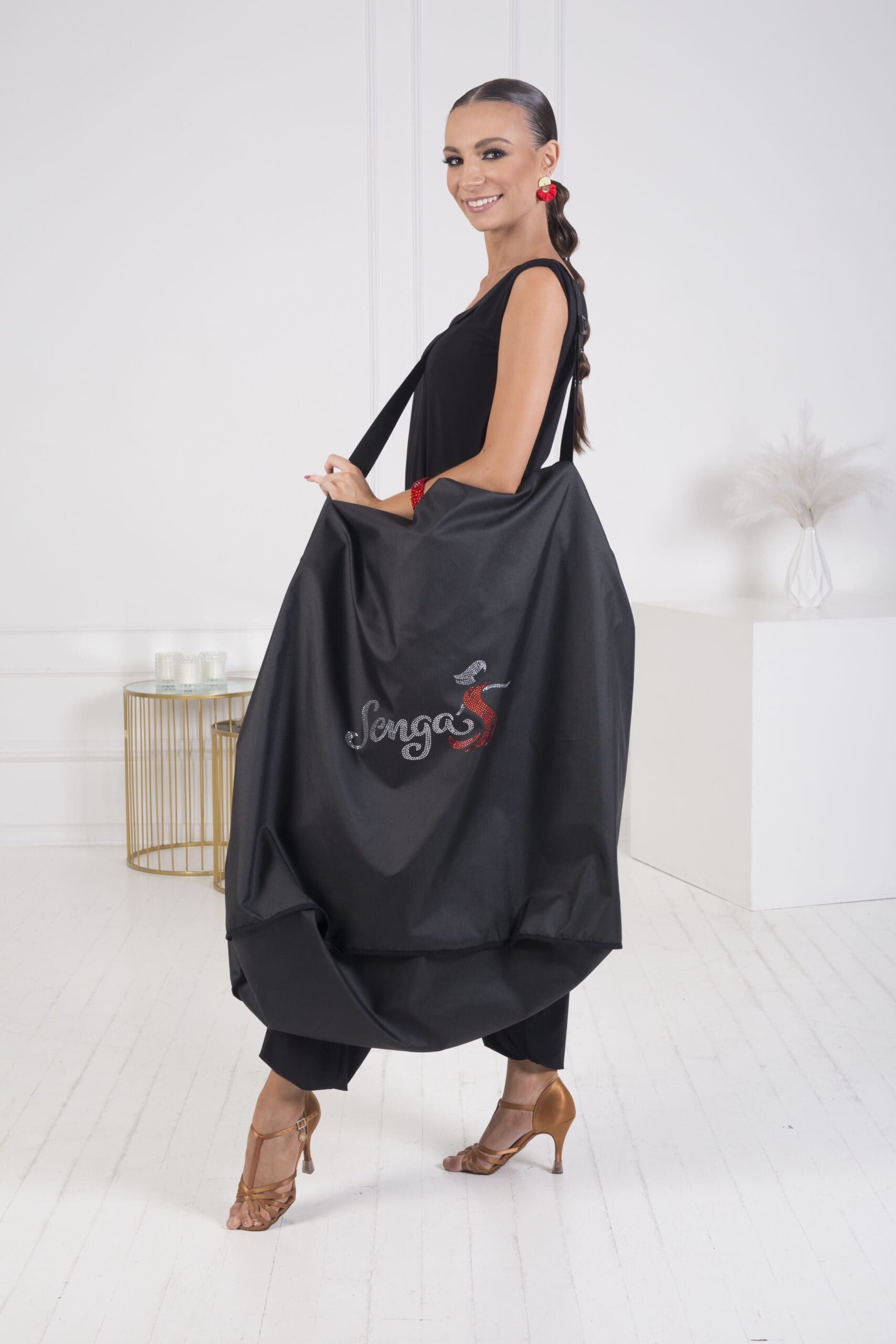 Model showcases a stylish black dancewear bag from Senga Dancewear.